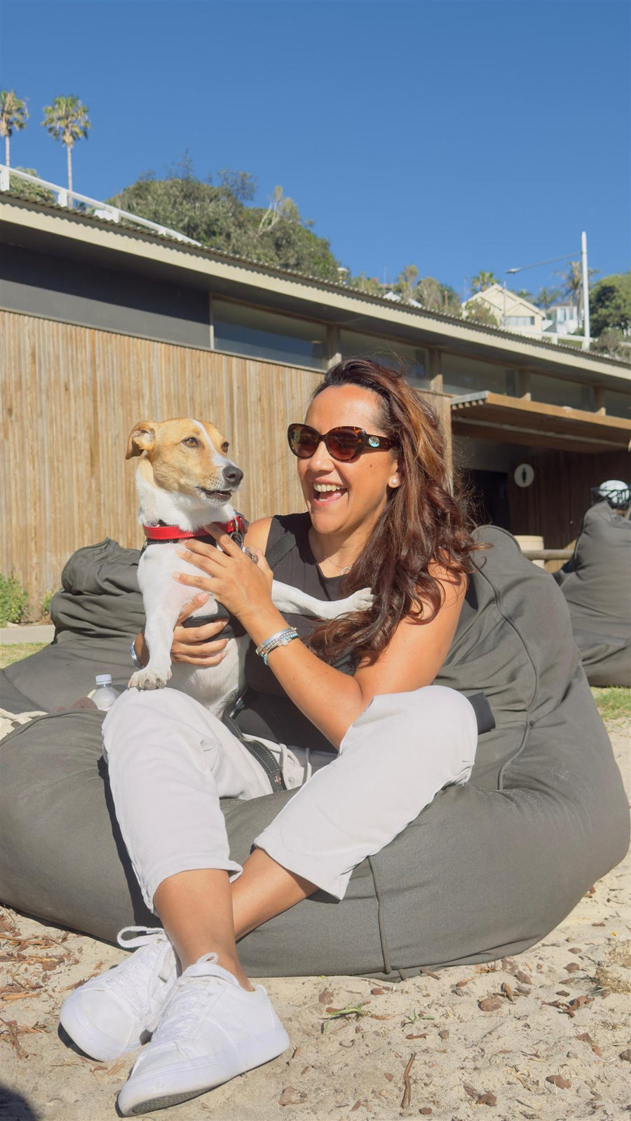Massy, Canivoro co-founder, laughing with Pablo at a Sydney beach