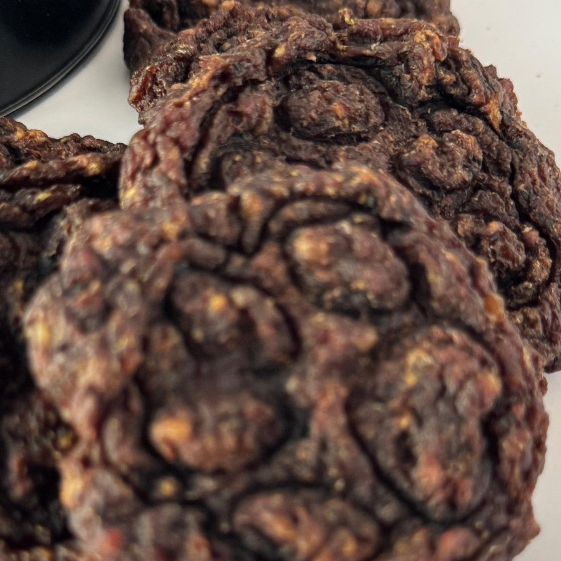 Close-up of the paw print pressed by hand into a Beef & Blueberry Bite
